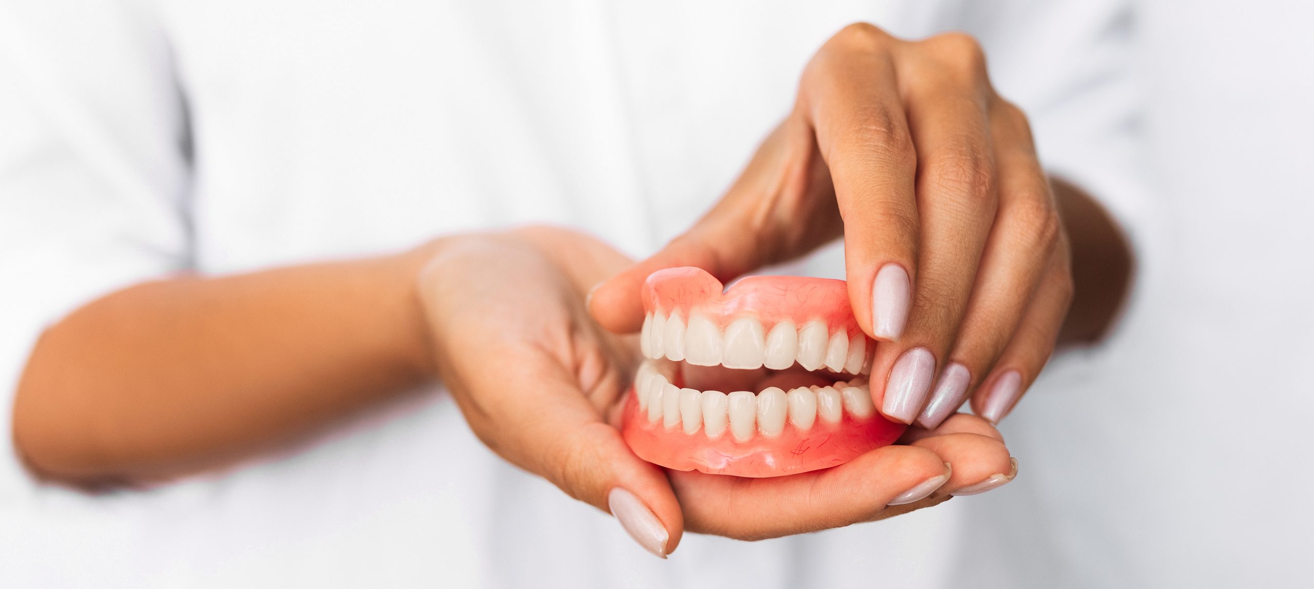 Dental Prosthesis In The Hands Of The Doctor Close 2023 11 27 05 09 50 Utc